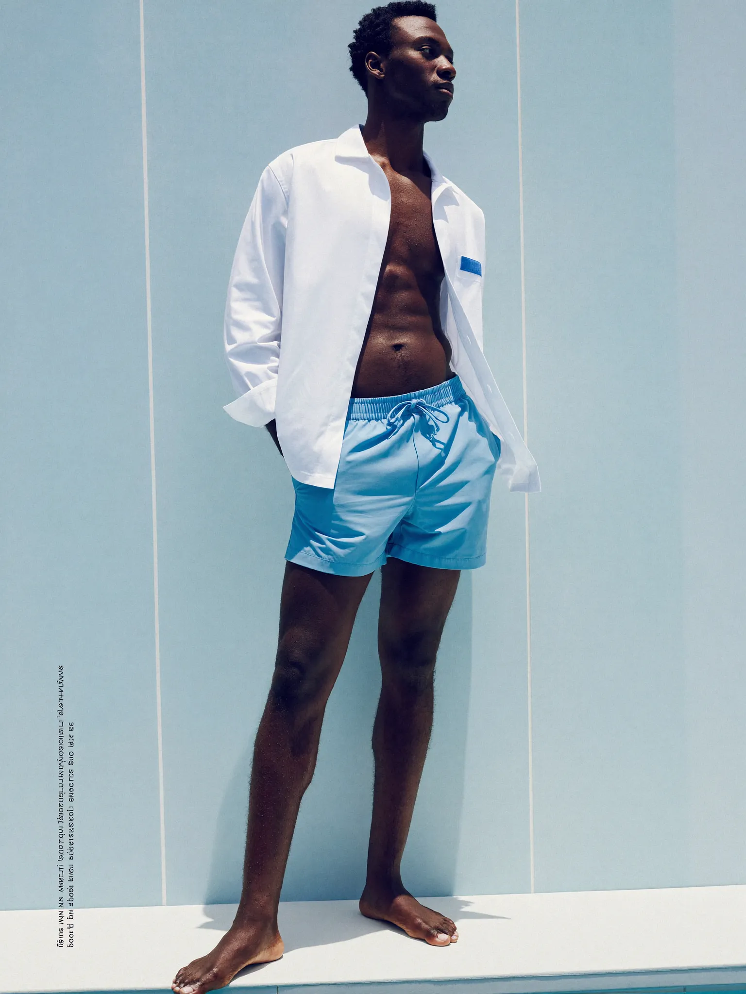 IceZone swimwear — ice-blue swim shorts worn with an open white camp shirt